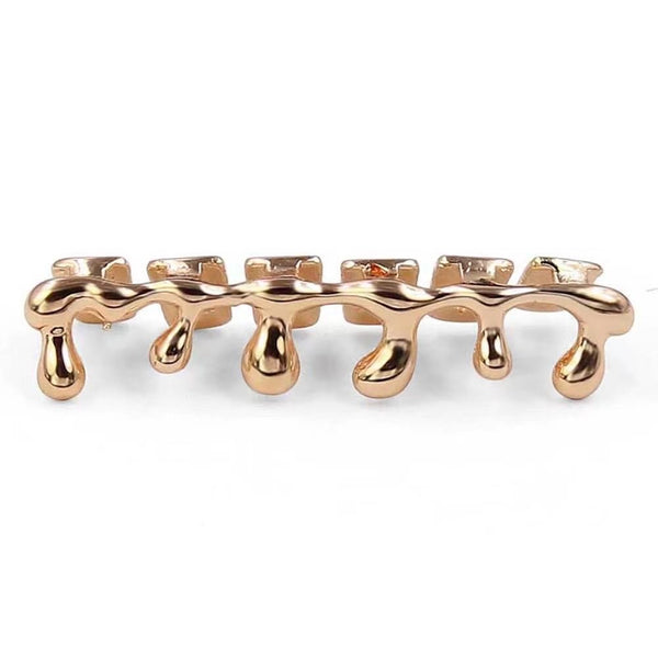 Gold drip grillz