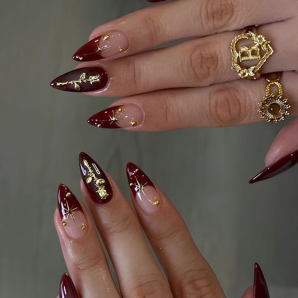 Red with gold charms press ons