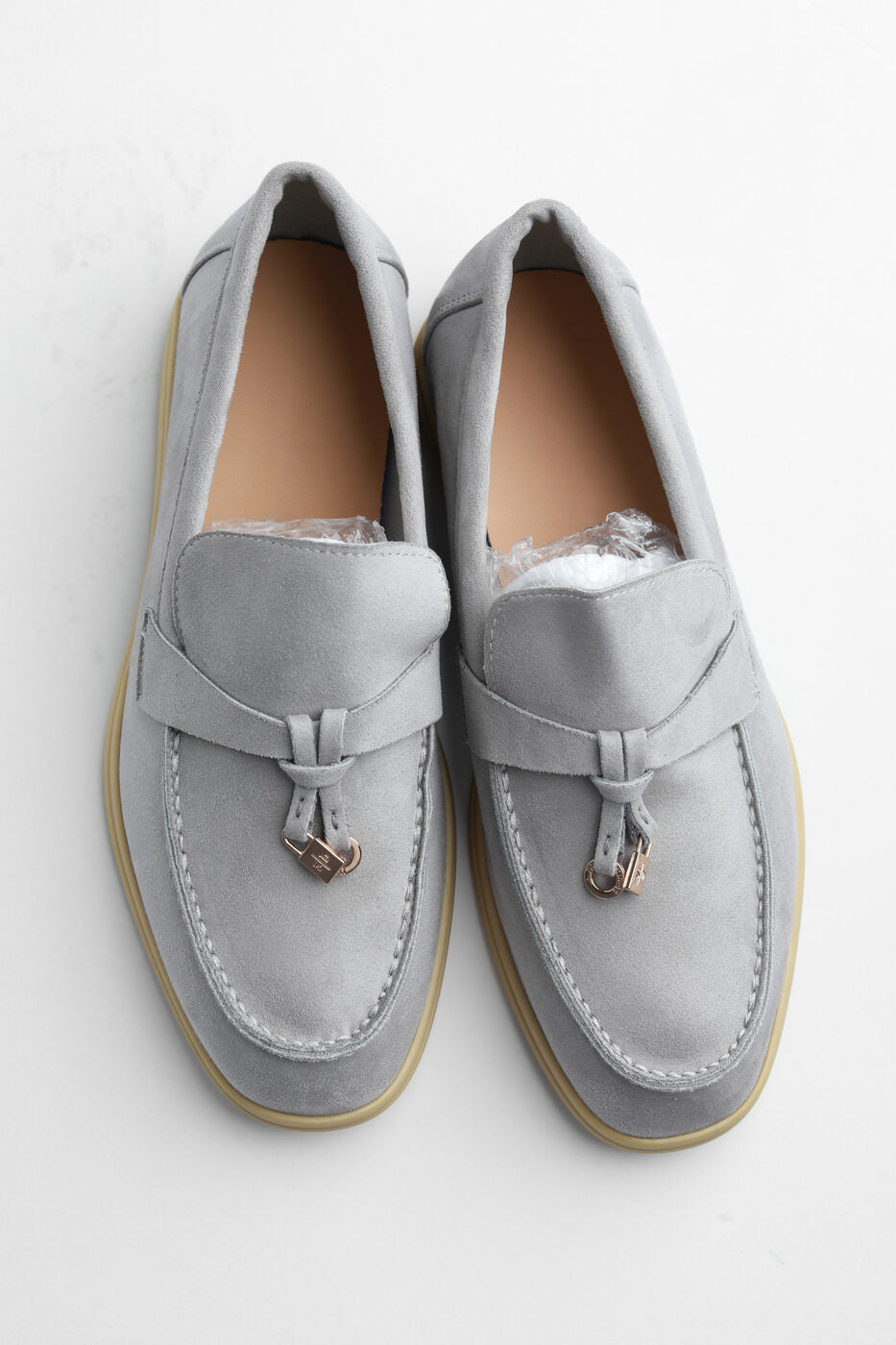 Belugga Clasp Loafer in grey suede with gold tasselled clasp, pair viewed from above
