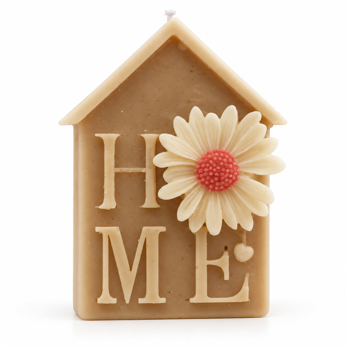 Home Candle – house-shaped HOME candle with a daisy, angled view
