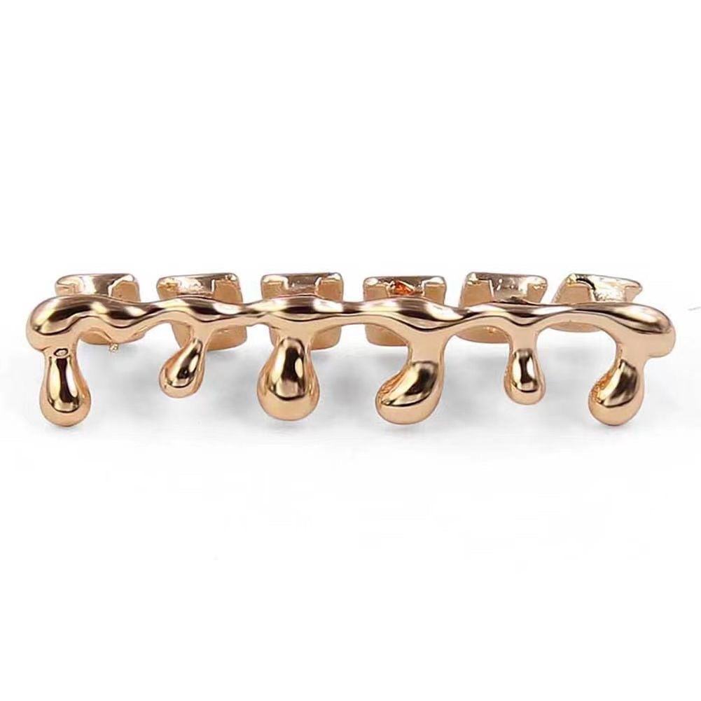 Gold drip grillz