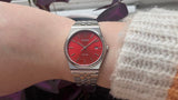 Silver casio red dial