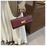 Minimalist crocodile handbag