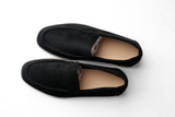Belugga Terra Loafer in black suede on a beige sole, pair viewed from above
