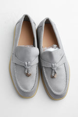 Belugga Clasp Loafer in grey suede with gold tasselled clasp, pair viewed from above