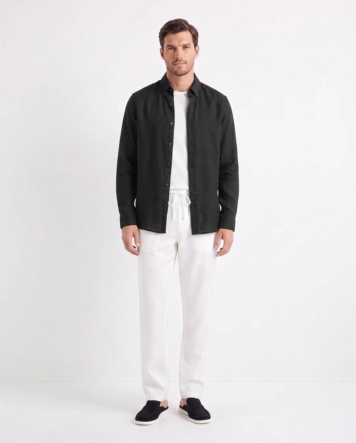 Linen Shirt — Black worn open over a white tee, with Linen Trouser, Drawstring — White and Dune Mule — Black
