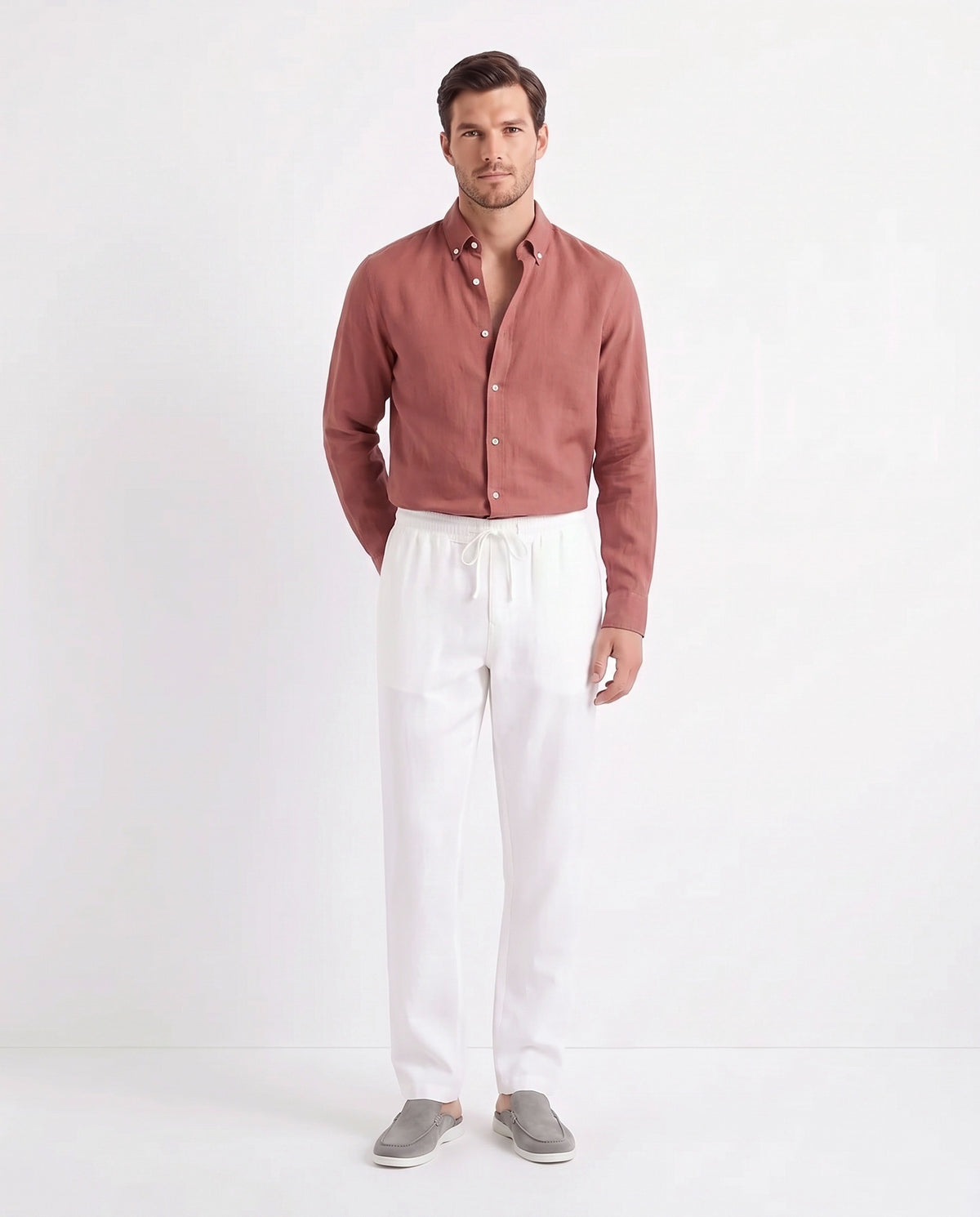 Linen Shirt — Brick Red worn tucked in, with Linen Trouser, Drawstring — White and Dune Mule — Grey