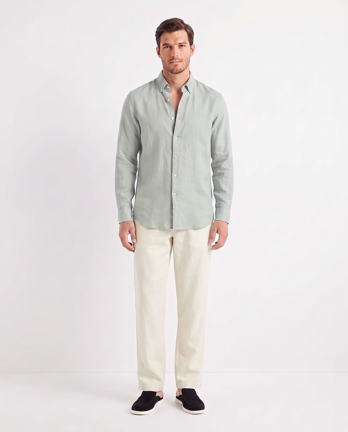 Linen Shirt — Light Grey worn untucked with the top two buttons open, with Linen Trouser, Button Waist — Cream and Dune Mule — Black