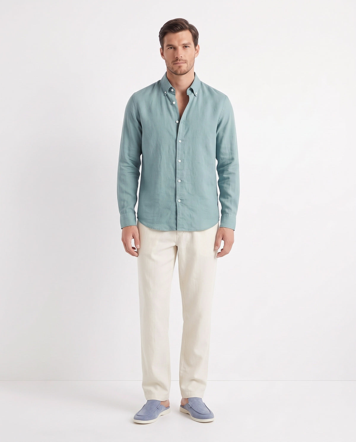 Linen Shirt — Teal worn untucked with the top two buttons open, with Linen Trouser, Button Waist — Cream and Dune Mule — Dusk Blue