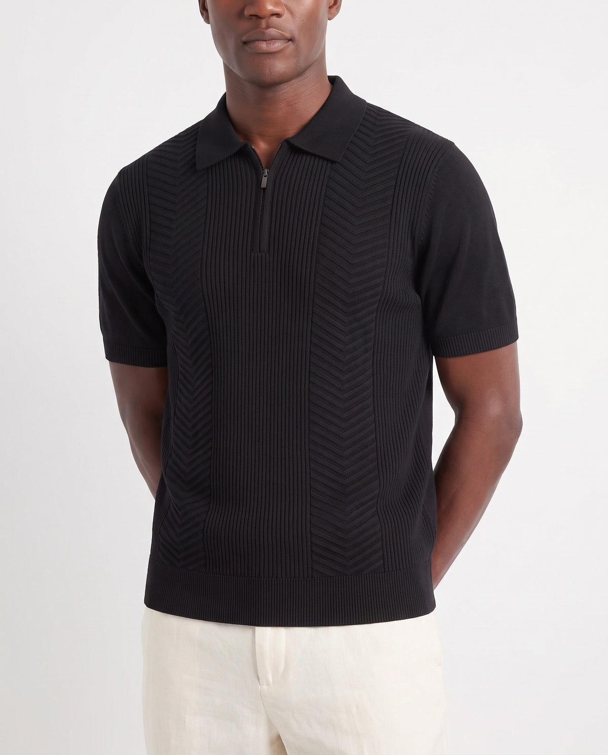 Chevron Quarter-Zip Knit Polo — Black — close-up on the model, worn with Linen Trouser, Button Waist — Cream and Dune Mule — Black