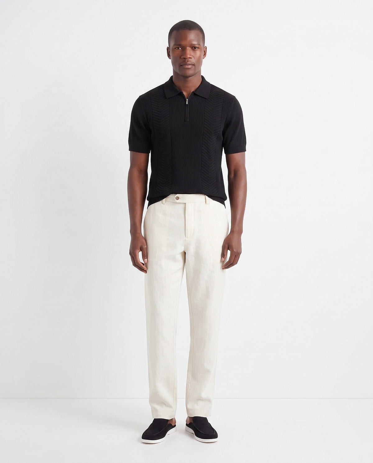 Chevron Quarter-Zip Knit Polo — Black — full look on the model, worn with Linen Trouser, Button Waist — Cream and Dune Mule — Black