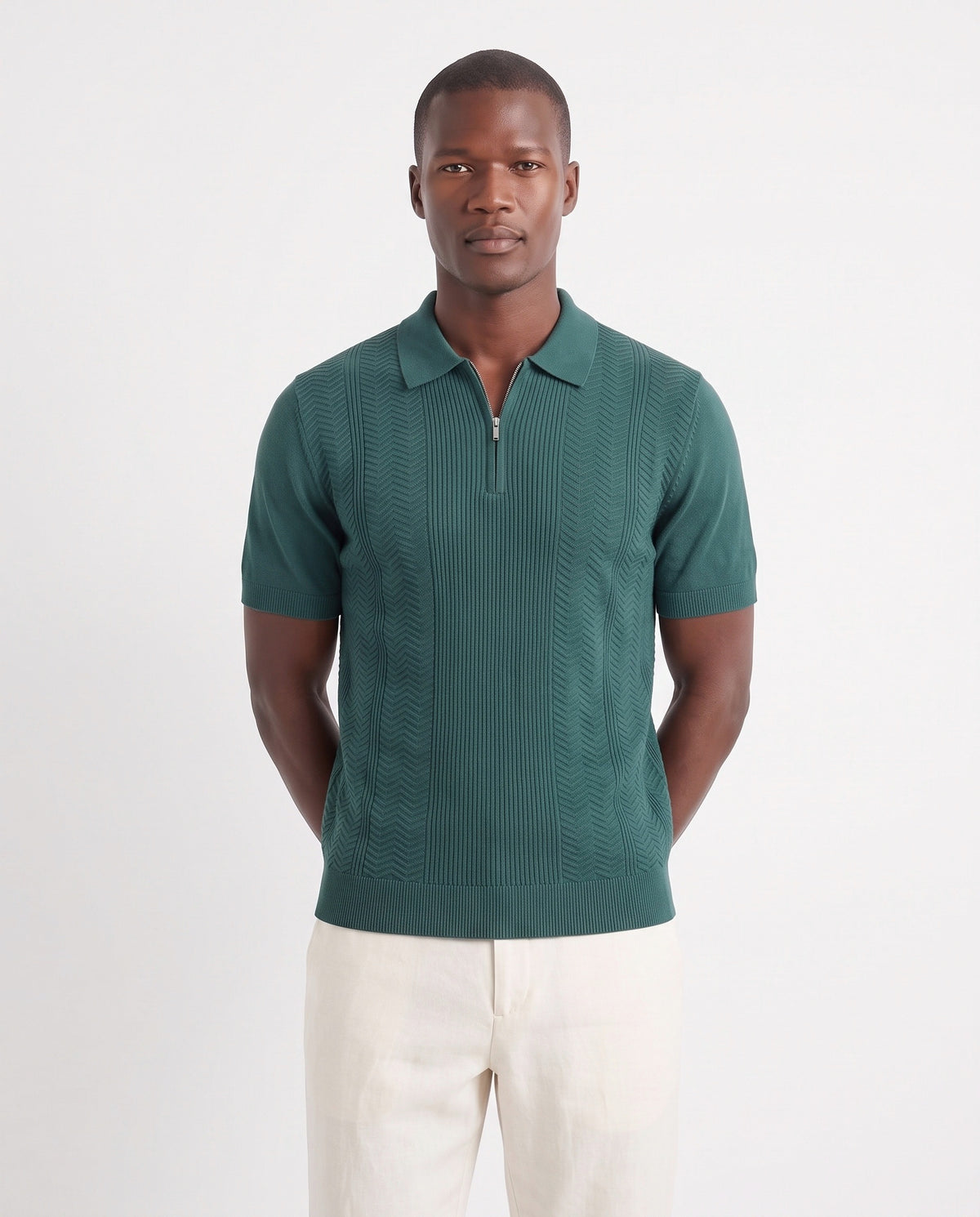 Chevron Quarter-Zip Knit Polo — Green — close-up on the model, worn with Linen Trouser, Button Waist — Cream and Terra Loafer — Cocoa, Beige Sole