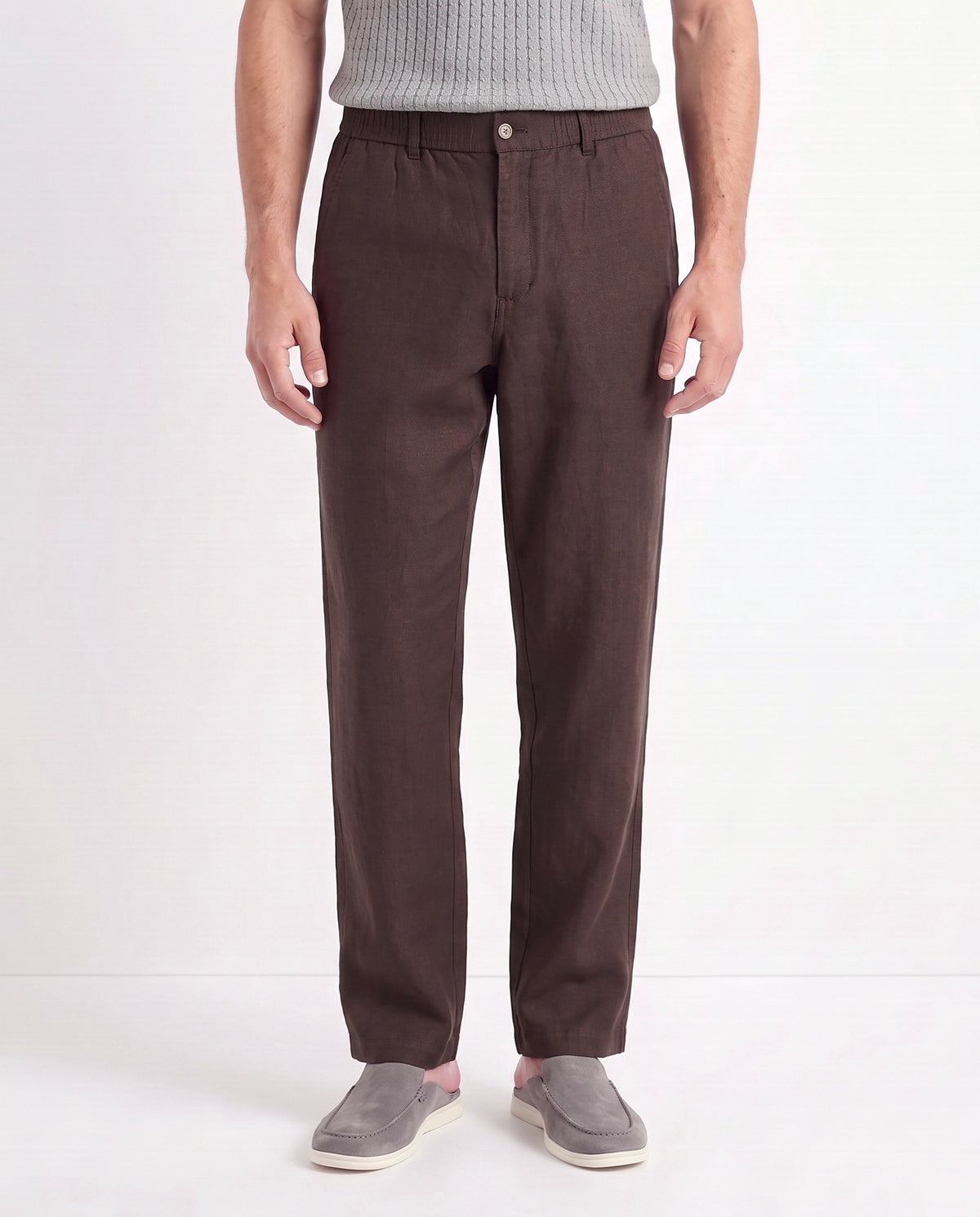 Linen Trouser, Button Waist — Dark Brown — close-up on the model, worn with Contrast Collar Knit Polo — Grey and Dune Mule — Grey