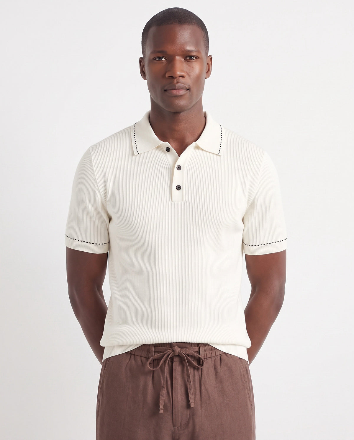 Stitch-Trim Ribbed Polo — White — close-up on the model, worn with Linen Trouser, Drawstring — Brown and Terra Loafer — Black Suede, Black Sole