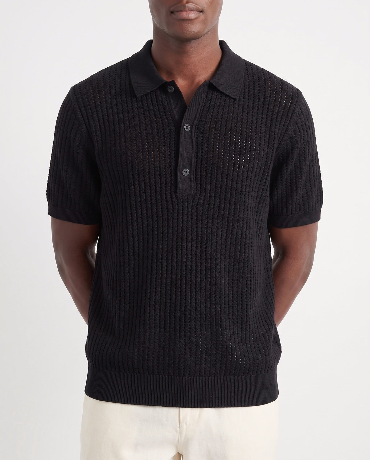 Textured Knit Polo — Black — close-up on the model, worn with Linen Trouser, Button Waist — Cream and Terra Loafer — Tobacco, Beige Sole