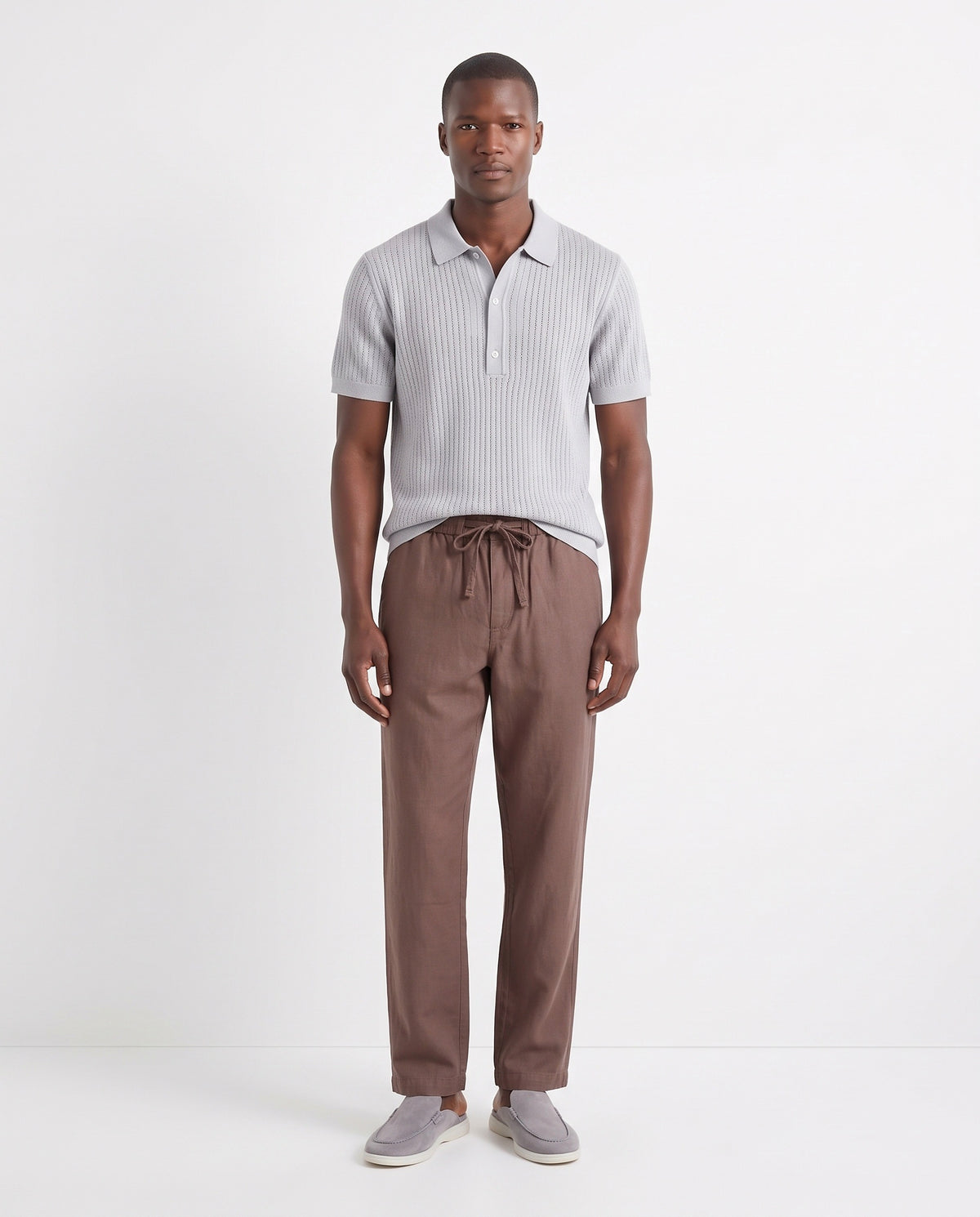 Textured Knit Polo — Light Grey — full look on the model, worn with Linen Trouser, Drawstring — Brown and Dune Mule — Grey