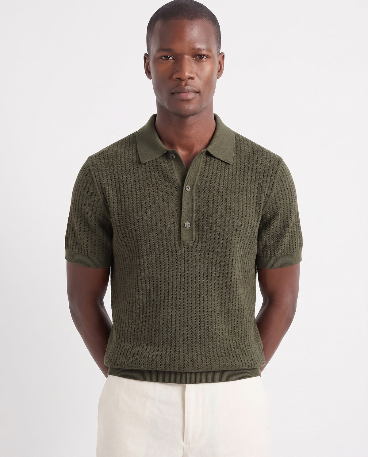 Textured Knit Polo — Dark Olive — close-up on the model, worn with Linen Trouser, Button Waist — Cream and Terra Loafer — Navy Suede, Beige Sole