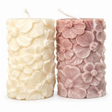 Floral Pillar Candles – ivory and dusty mauve flower-relief pillar candles, front view