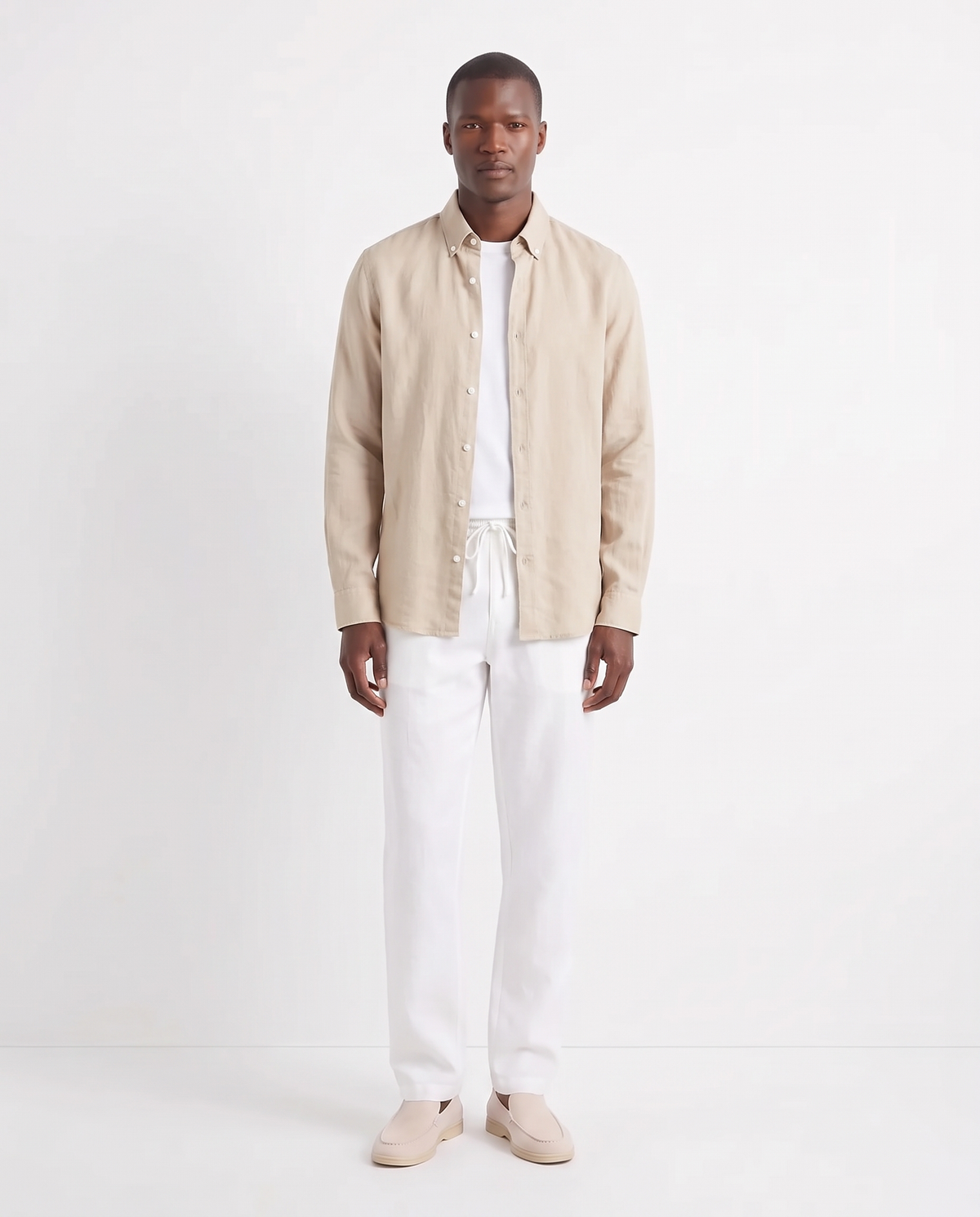 Linen Shirt — Sand worn open over a white tee, with Linen Trouser, Drawstring — White and Terra Loafer — Cream, Beige Sole
