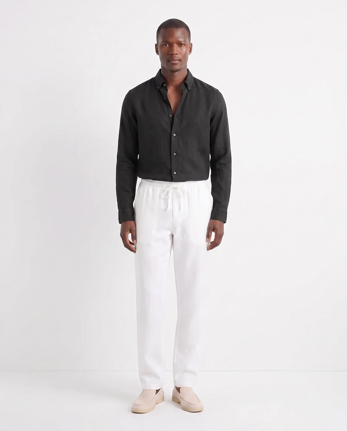 Linen Shirt — Black worn untucked with the top two buttons open, with Linen Trouser, Drawstring — White and Terra Loafer — Cream, Beige Sole