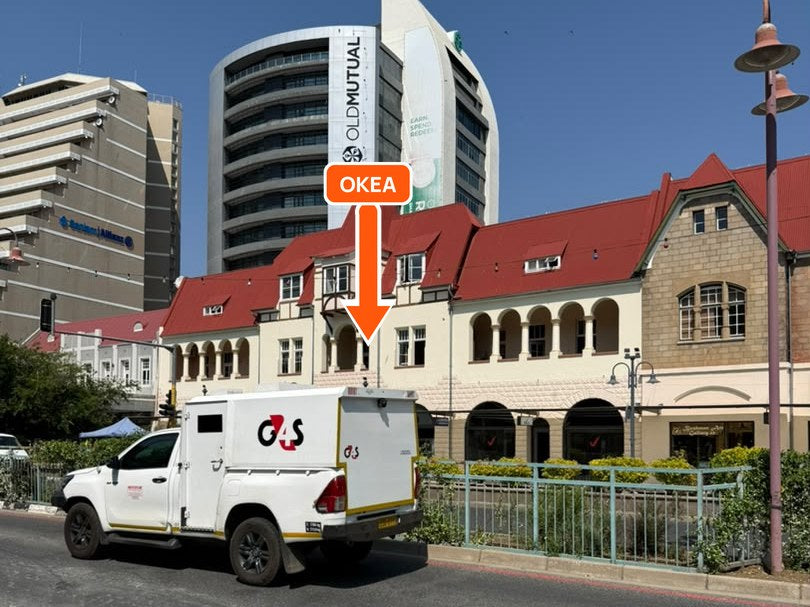The red-roofed buildings below the Old Mutual tower